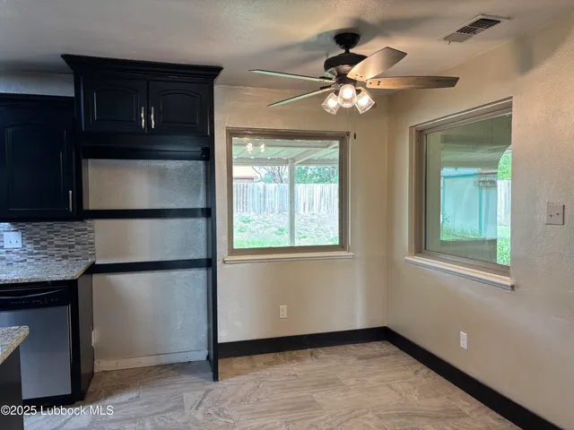 a view of a bathroom with sink and mirror