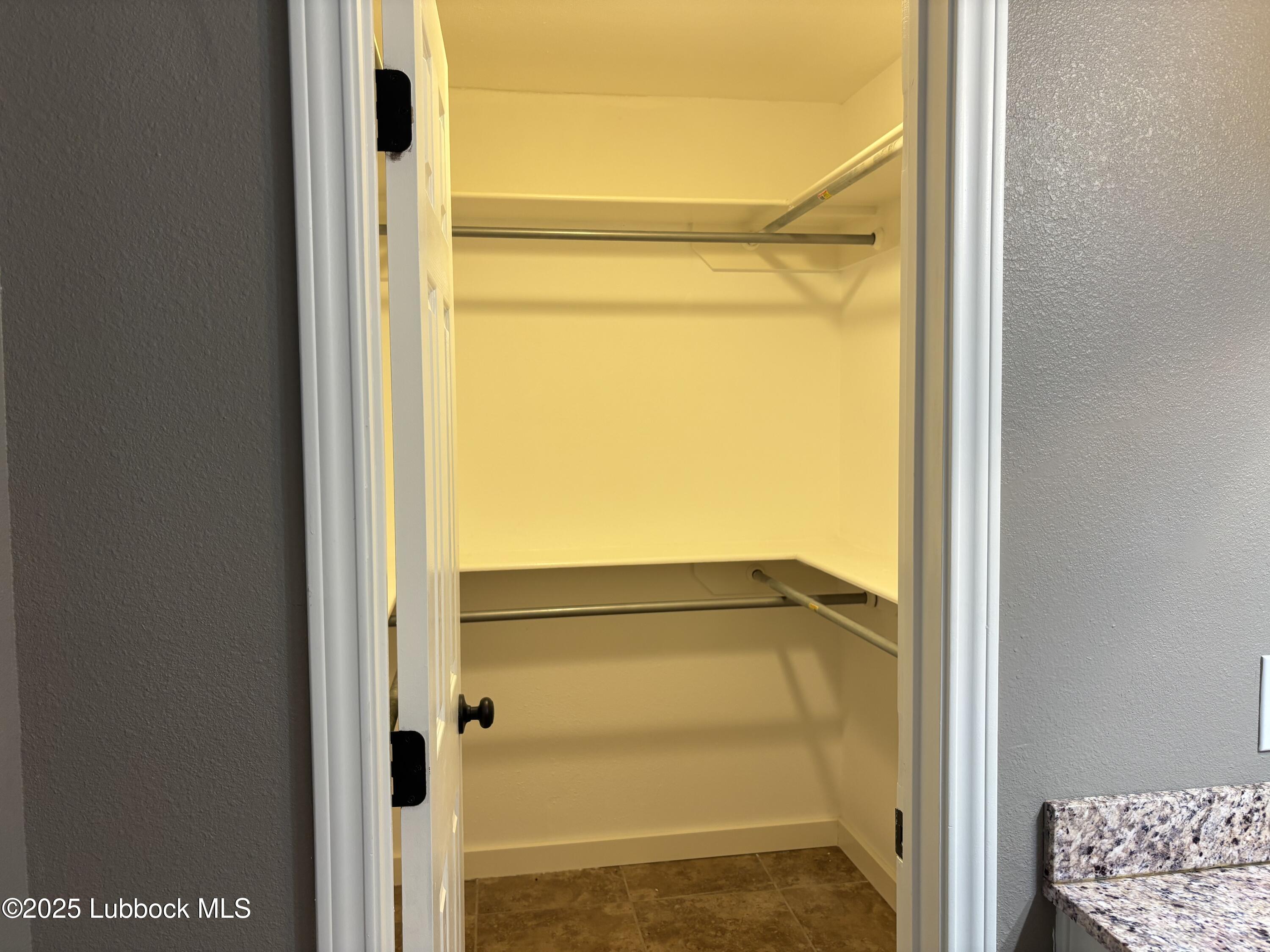 5 Parklane Drive Ransom Canyon, TX 79366 - Photo 23 of 30 a bathroom with a glass shower door