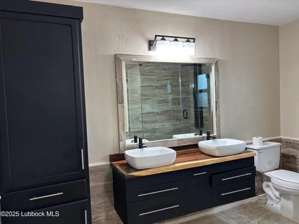 a bathroom with sink and mirror