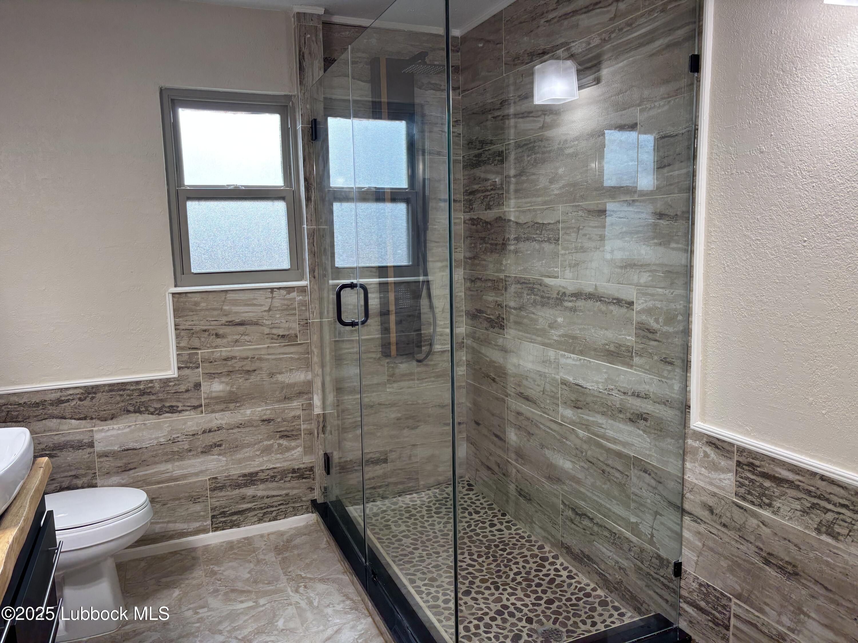 5 Parklane Drive Ransom Canyon, TX 79366 - Photo 29 of 30 a bathroom with a toilet and a shower
