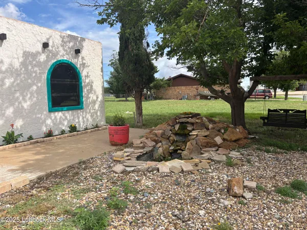 a view of a garden with an outdoor space