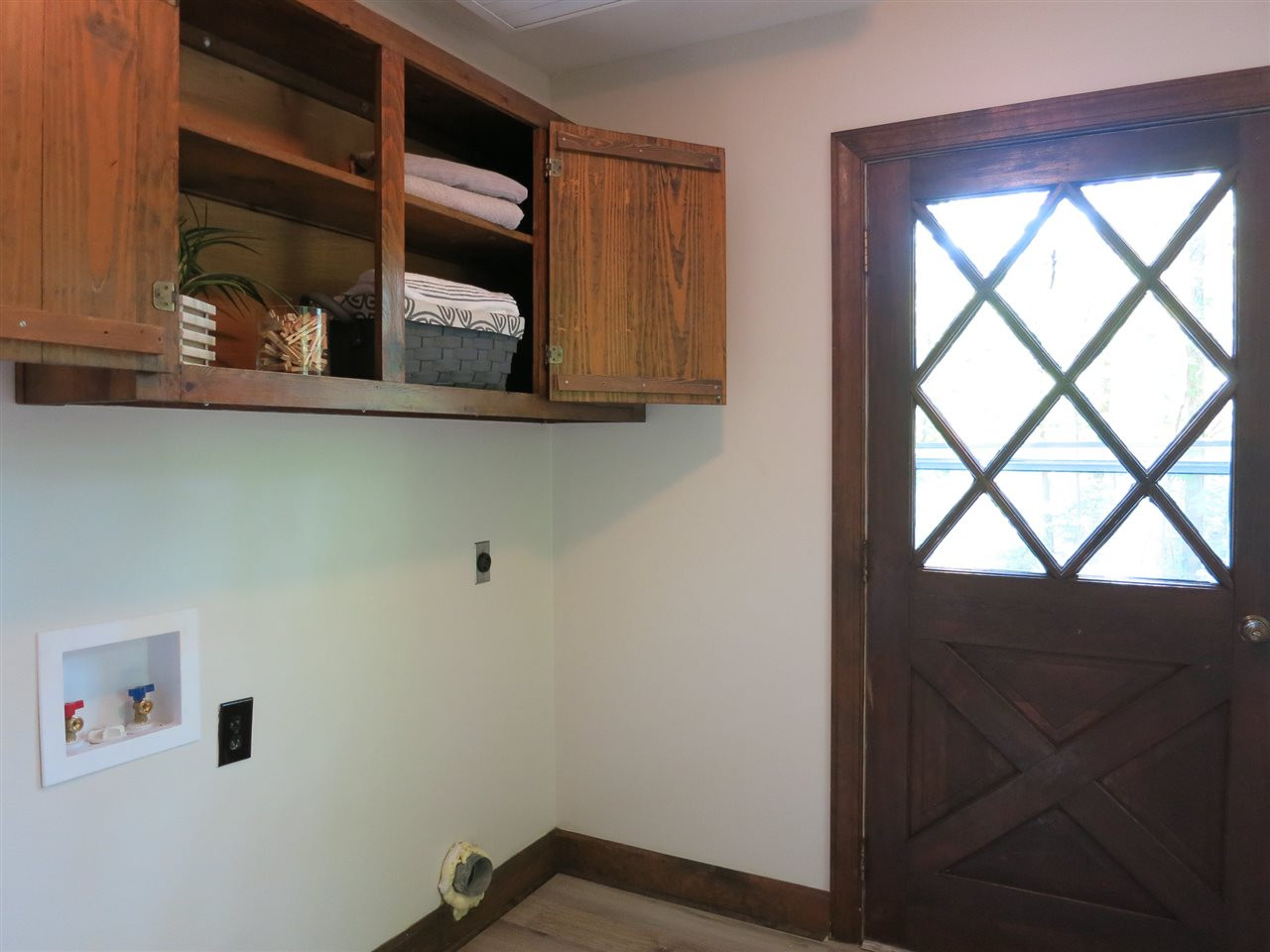 809 Ivanhoe Drive Raleigh, NC 27615 - Photo 17 of 30 Adjacent Laundry/Mud Rm w/LVP flooring, closet & wall cabinets exits to driveway. Laundry/Mud Rm