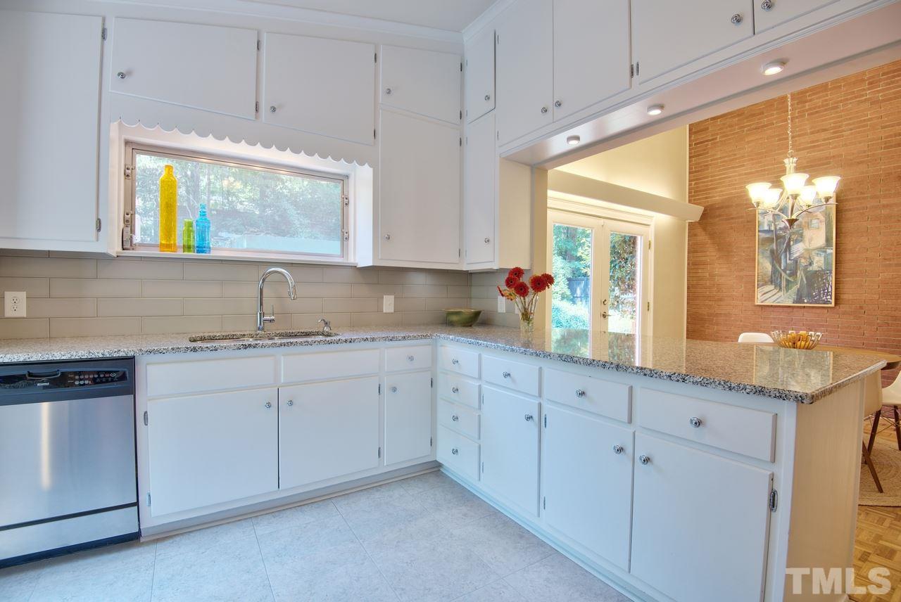 1207 Woodburn Road Durham, NC 27705 - Photo 8 of 25 Plenty of cabinet storage in this efficient use of space! You'll appreciate having a place for everything & everything in it's place.