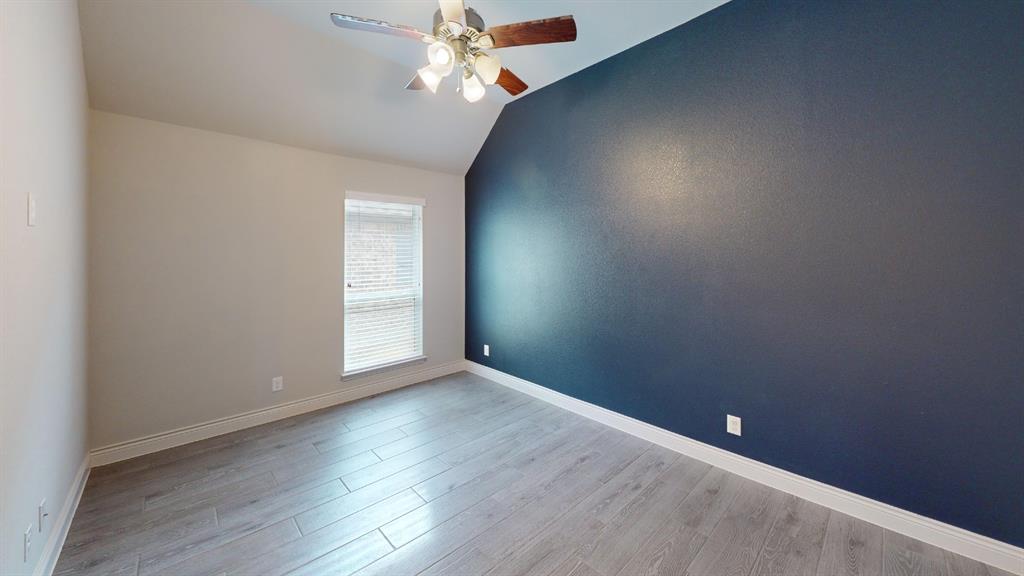1516 Twistleaf Road Flower Mound, TX 76226 - Photo 13 of 22 an empty room with wooden floor chandelier fan and windows