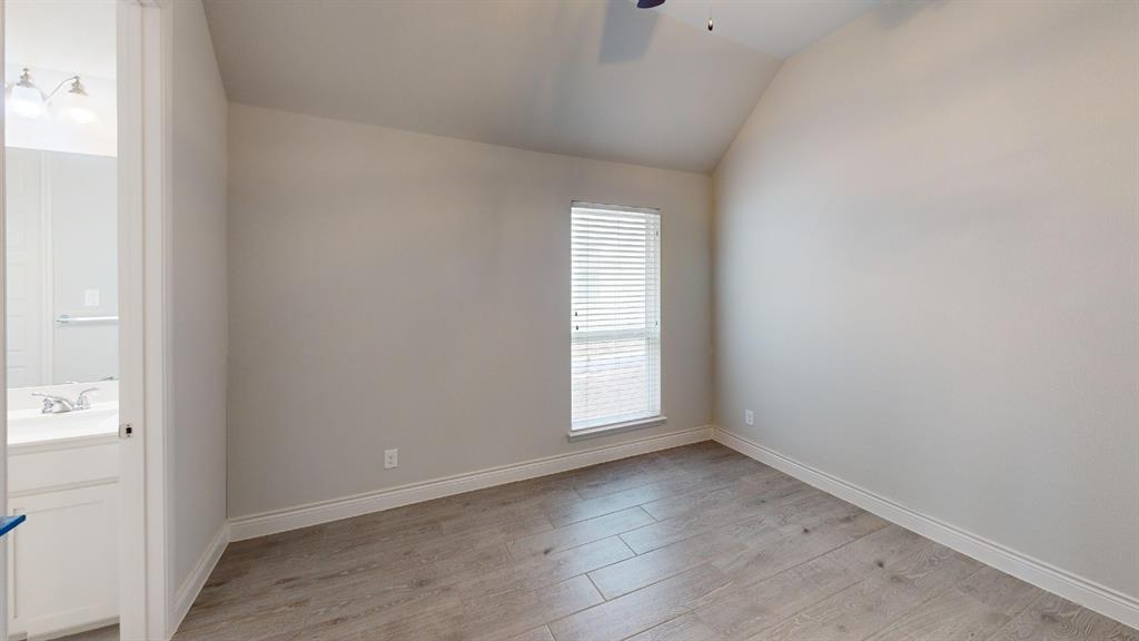 1516 Twistleaf Road Flower Mound, TX 76226 - Photo 15 of 22 an empty room with wooden floor and windows