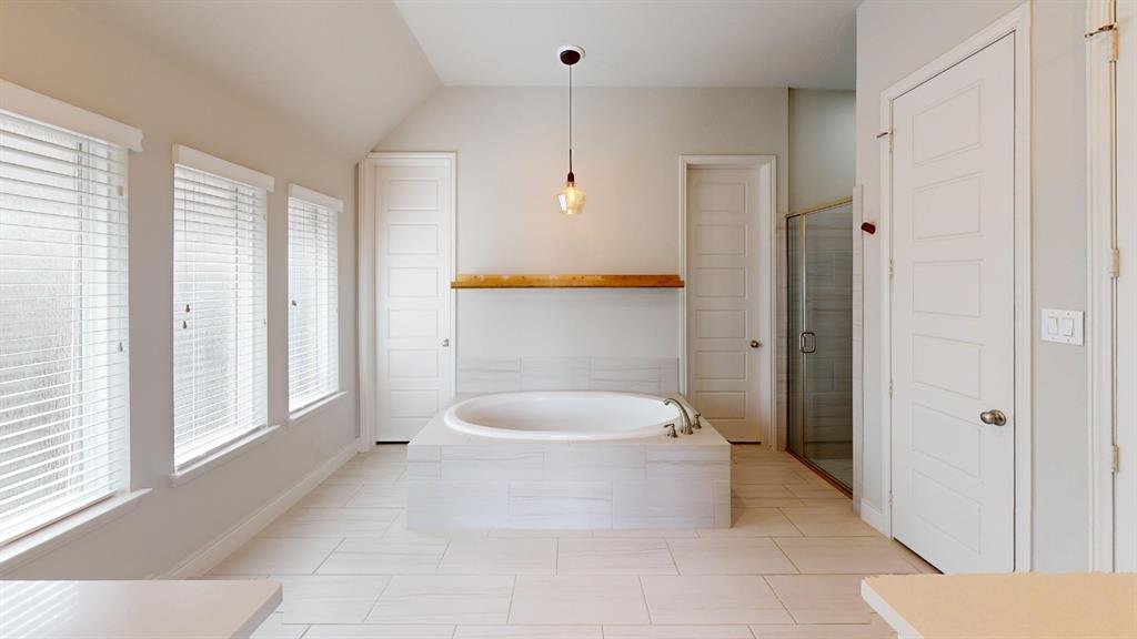 1516 Twistleaf Road Flower Mound, TX 76226 - Photo 18 of 22 a bathroom with a sink a toilet and shower