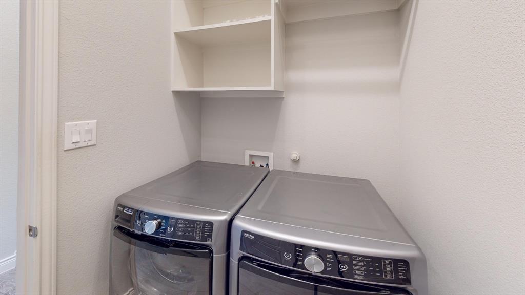 1516 Twistleaf Road Flower Mound, TX 76226 - Photo 20 of 22 a utility room with dryer and washer