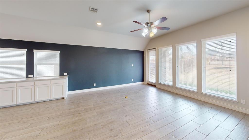 1516 Twistleaf Road Flower Mound, TX 76226 - Photo 8 of 22 a view of an empty room with window and cabinet