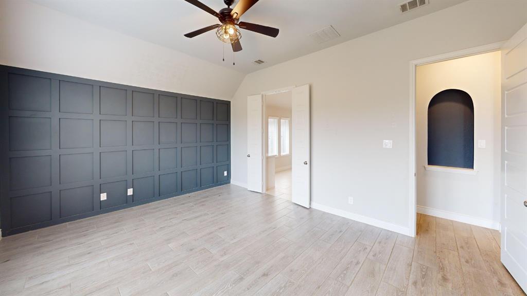 1516 Twistleaf Road Flower Mound, TX 76226 - Photo 9 of 22 a view of empty room with wooden floor and fan