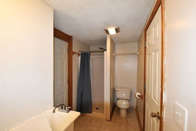 a view of a hallway with washer and dryer