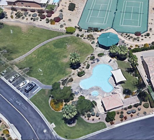 an aerial view of a house with outdoor space