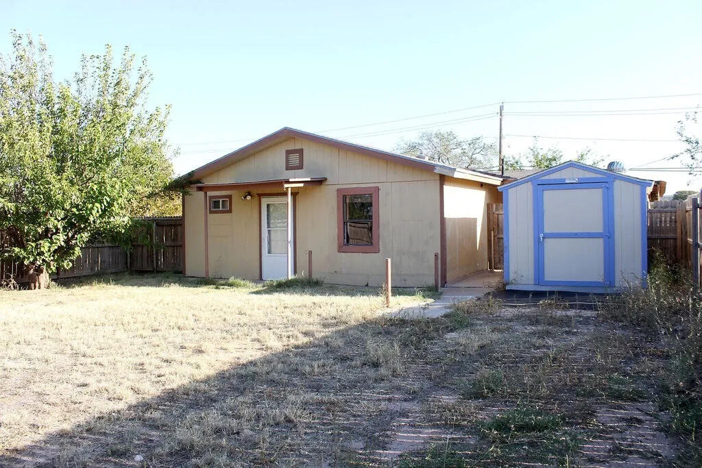 811 East 16th Street Big Spring, TX 79720 - Photo 19 of 20 a front view of a house with a yard
