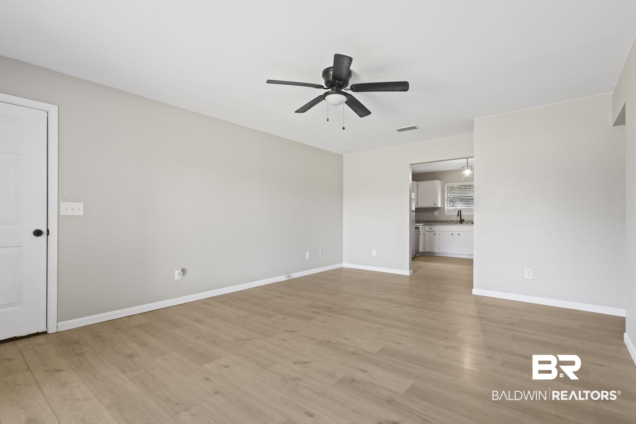 309 West Roosevelt Avenue Foley, AL 36535 - Photo 15 of 60 Unfurnished living room with light wood-type flooring, ceiling fan, and sink