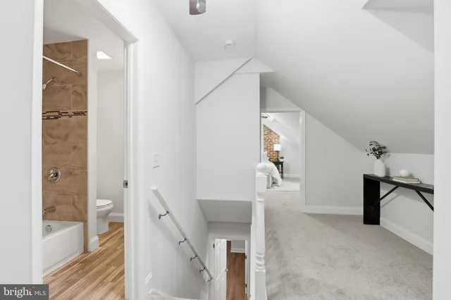 a view of a hallway view with staircase