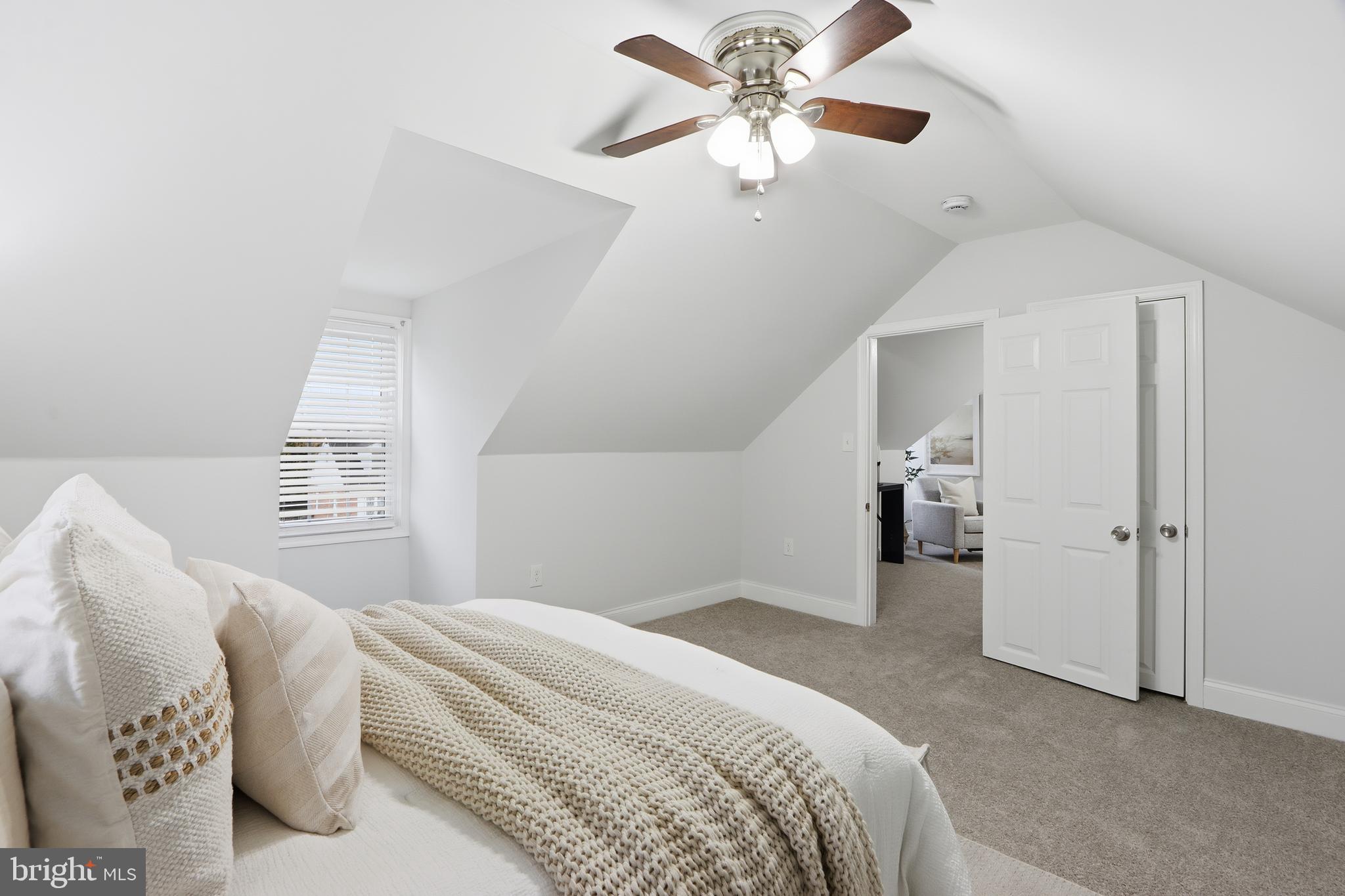 3497 Hillsmere Road Gwynn Oak, MD 21207 - Photo 30 of 45 a bedroom with a large bed and a chandelier