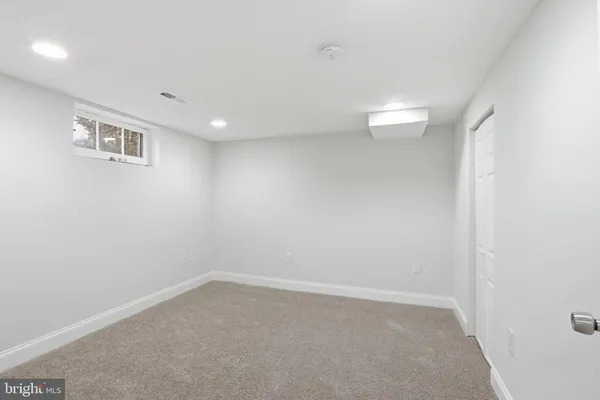a work room with furniture and book shelf