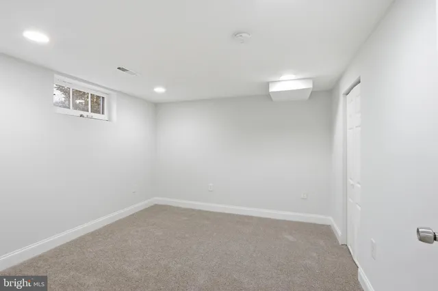 a work room with furniture and book shelf