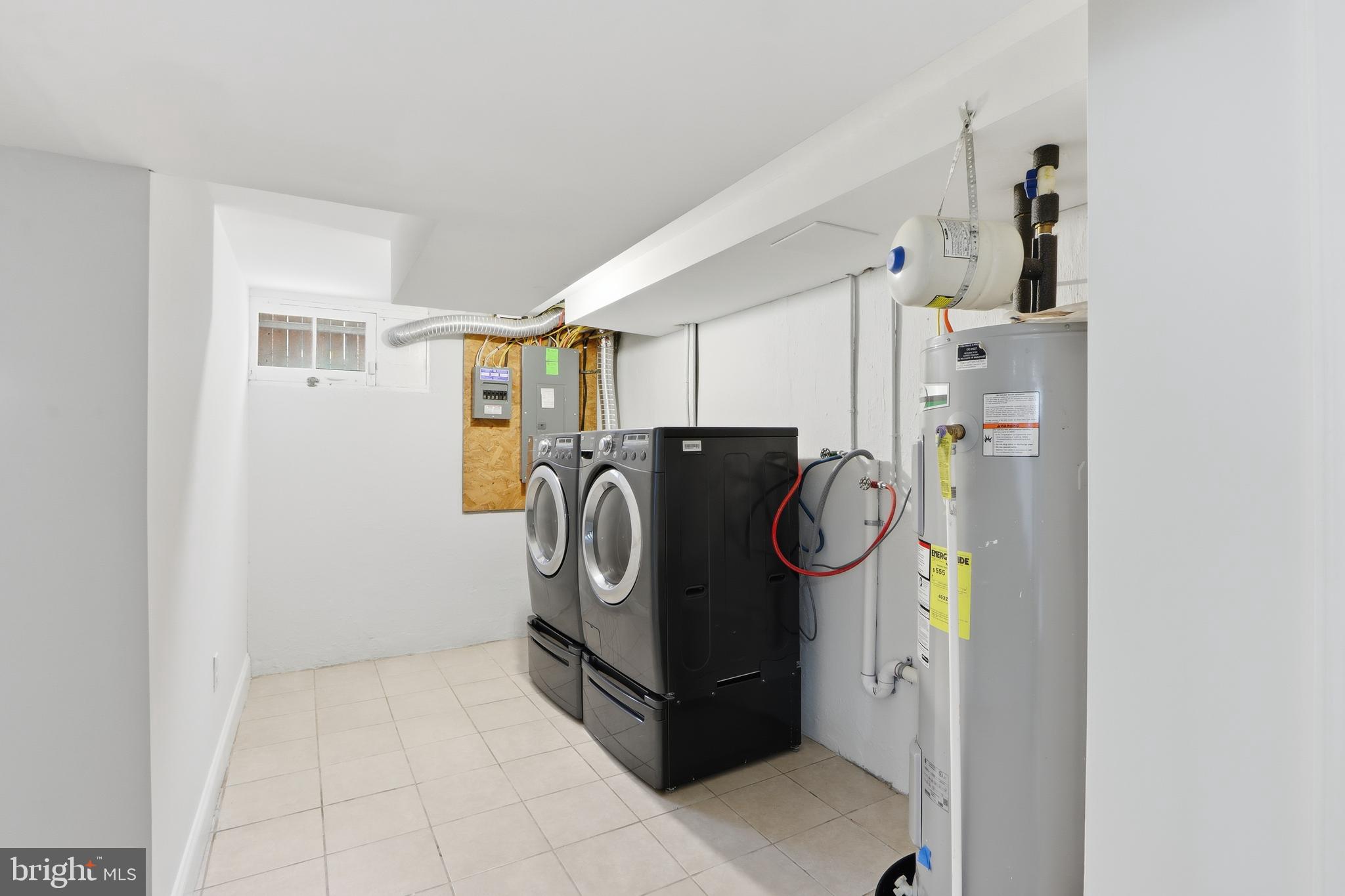 3497 Hillsmere Road Gwynn Oak, MD 21207 - Photo 40 of 45 a utility room with refrigerator and washer