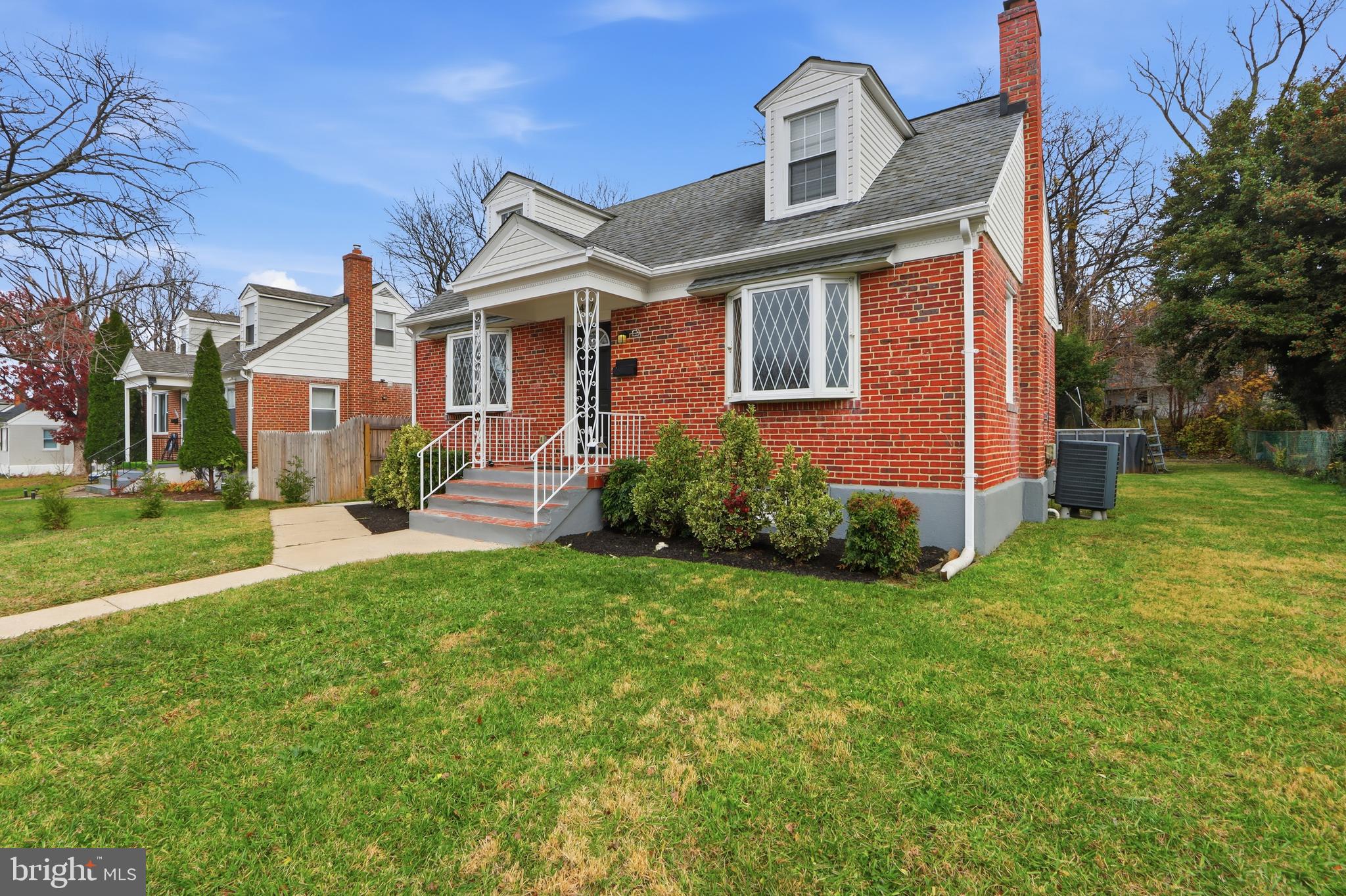 3497 Hillsmere Road Gwynn Oak, MD 21207 - Photo 4 of 45 a front view of a house with a yard