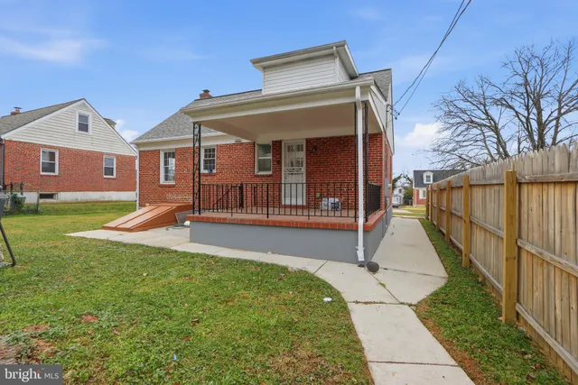 a view of a house with a yard patio and a yard