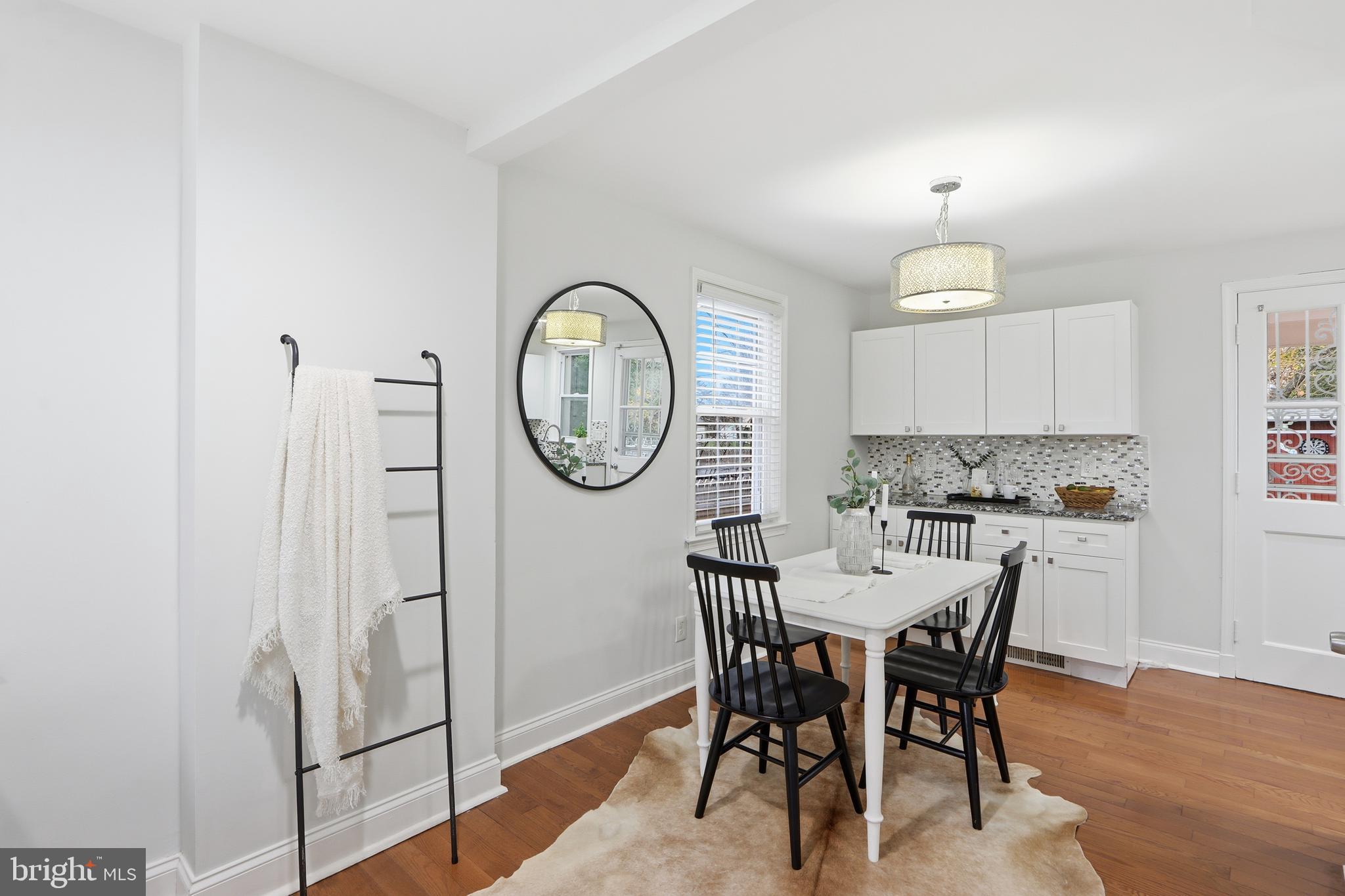 3497 Hillsmere Road Gwynn Oak, MD 21207 - Photo 9 of 45 a view of a dining room with furniture window and wooden floor