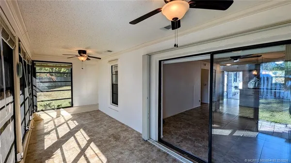 a view of entryway livingroom and hall with wooden floor