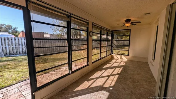 a view of a balcony with wooden floor