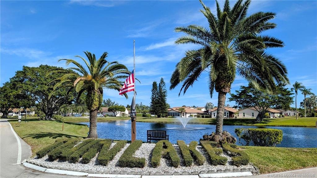 6531 Southeast Federal Highway, Unit A109 Stuart, FL 34997 - Photo 21 of 21 a view of a yard with palm trees