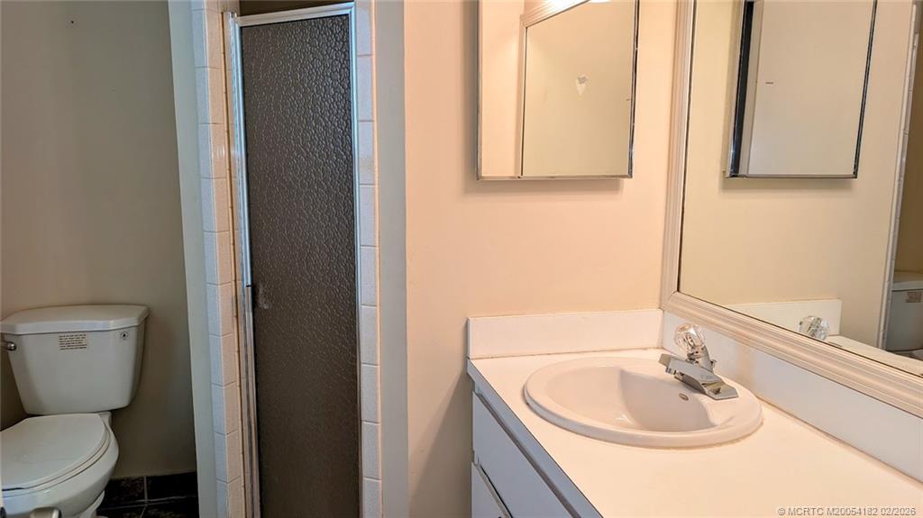 6531 Southeast Federal Highway, Unit A109 Stuart, FL 34997 - Photo 8 of 21 a bathroom with a sink and a toilet