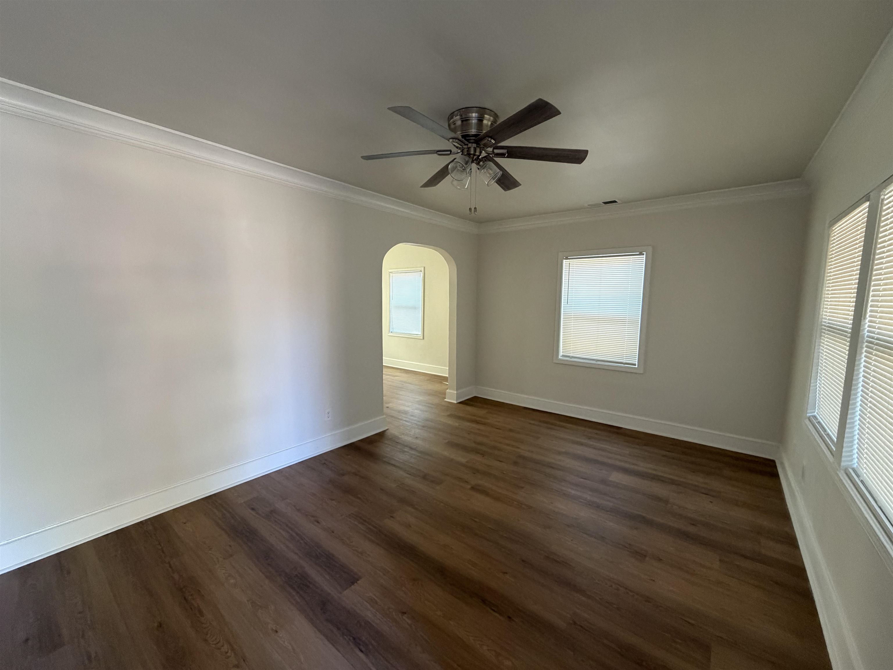 3739 Rhea Avenue Memphis, TN 38122 - Photo 2 of 10 a view of empty room with wooden floor and fan