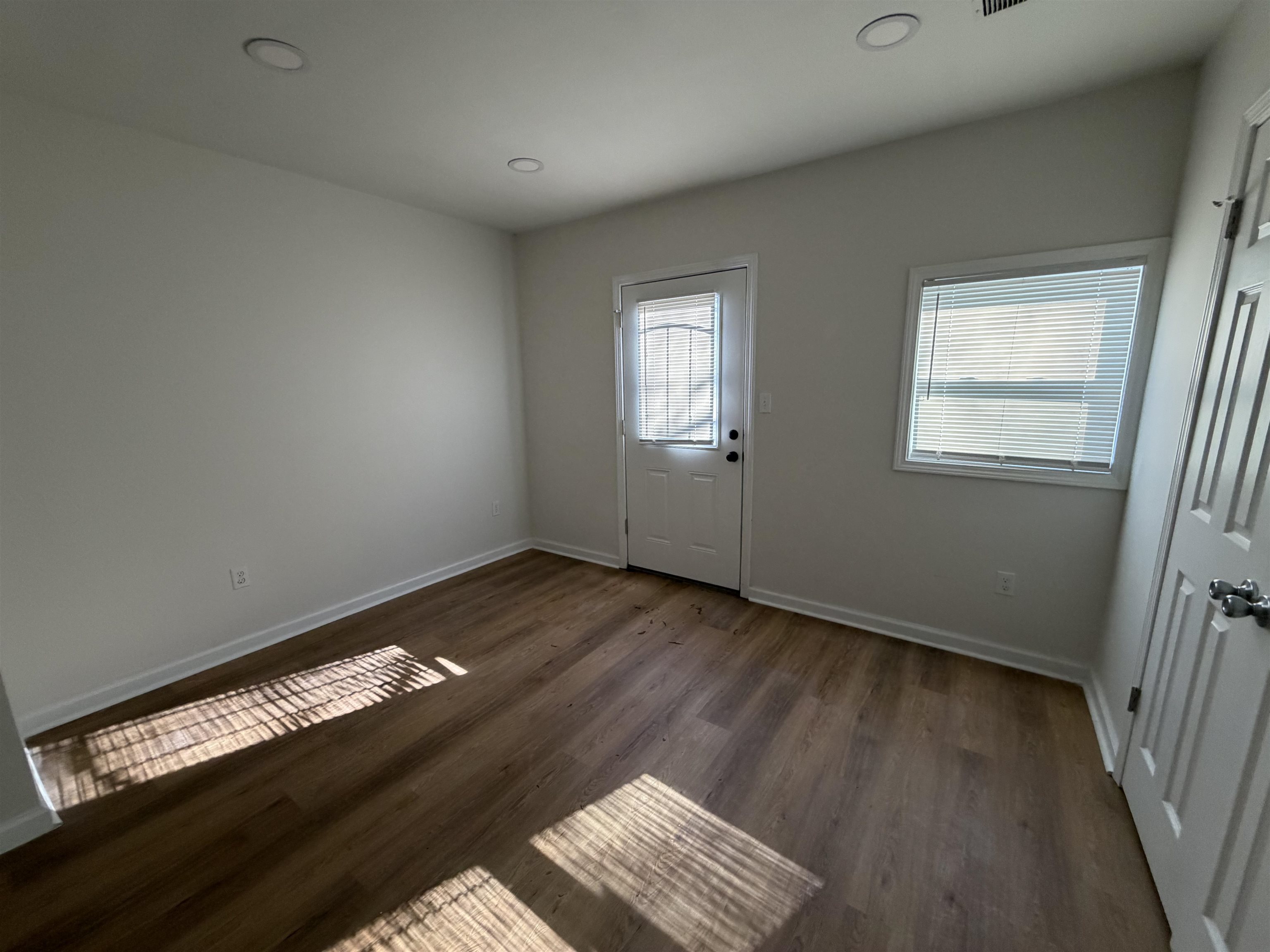 3739 Rhea Avenue Memphis, TN 38122 - Photo 9 of 10 a view of an empty room and wooden floor