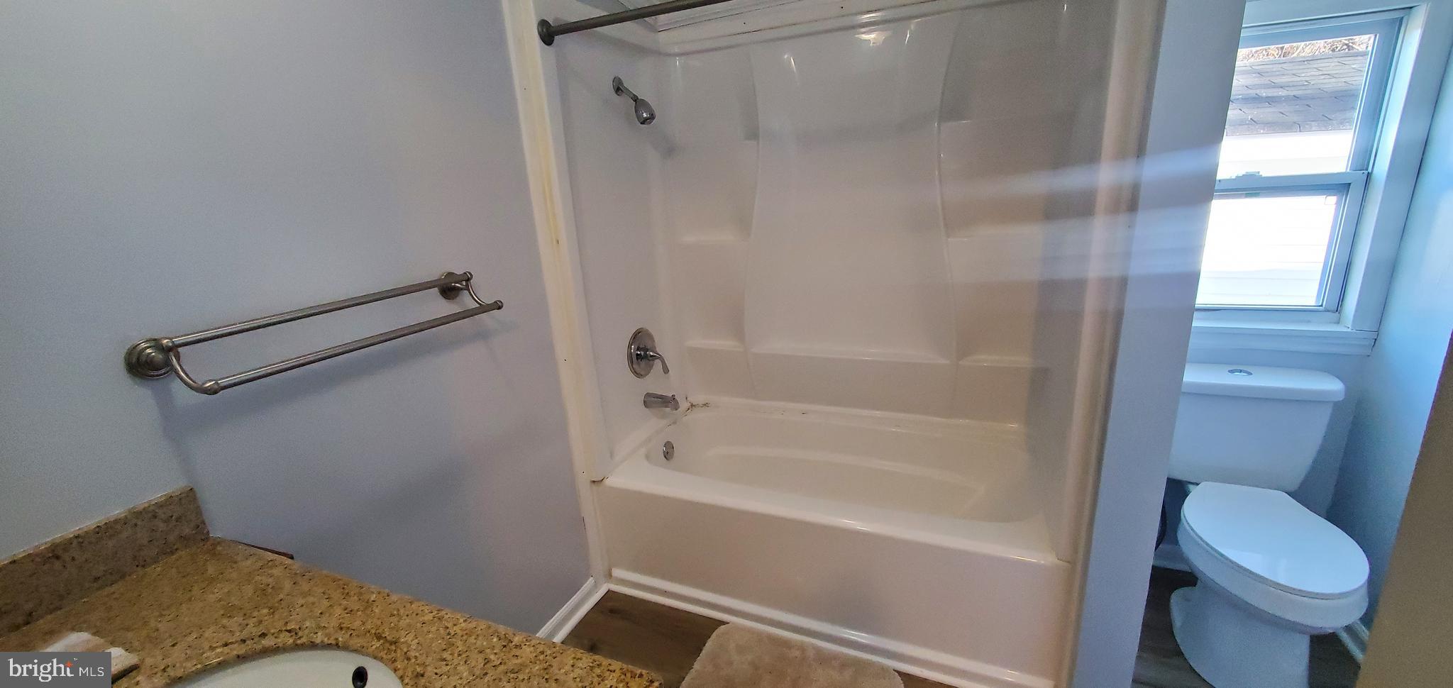 123 Wood Road Aberdeen, MD 21001 - Photo 15 of 23 a bathroom with a granite countertop toilet and a tub