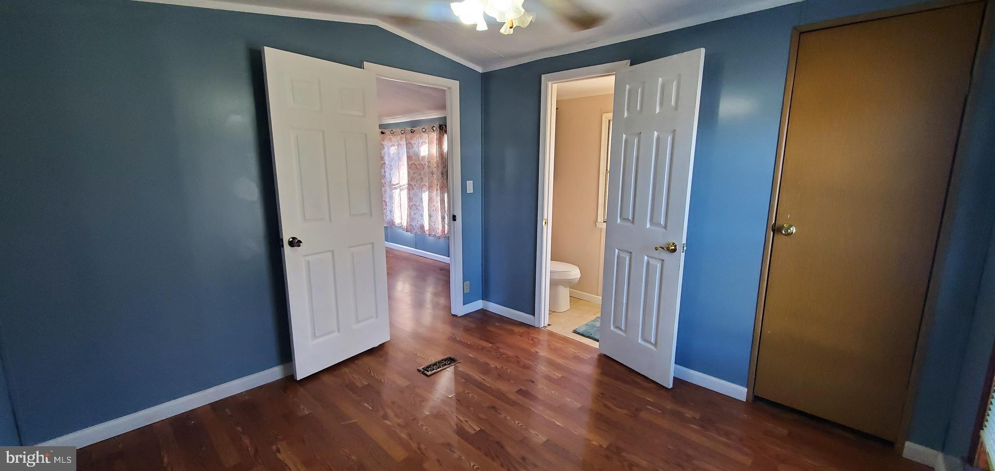 123 Wood Road Aberdeen, MD 21001 - Photo 19 of 23 an empty room with windows and wooden floor