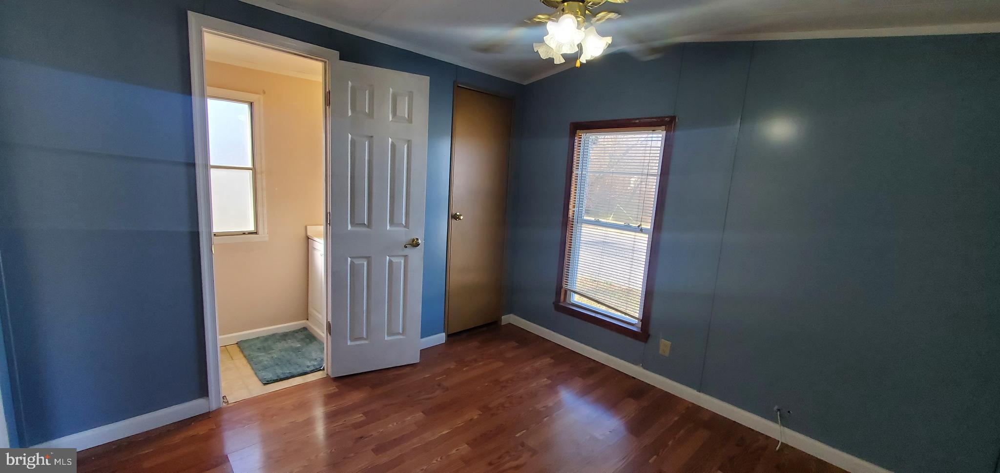 123 Wood Road Aberdeen, MD 21001 - Photo 20 of 23 wooden floor in an empty room with a window