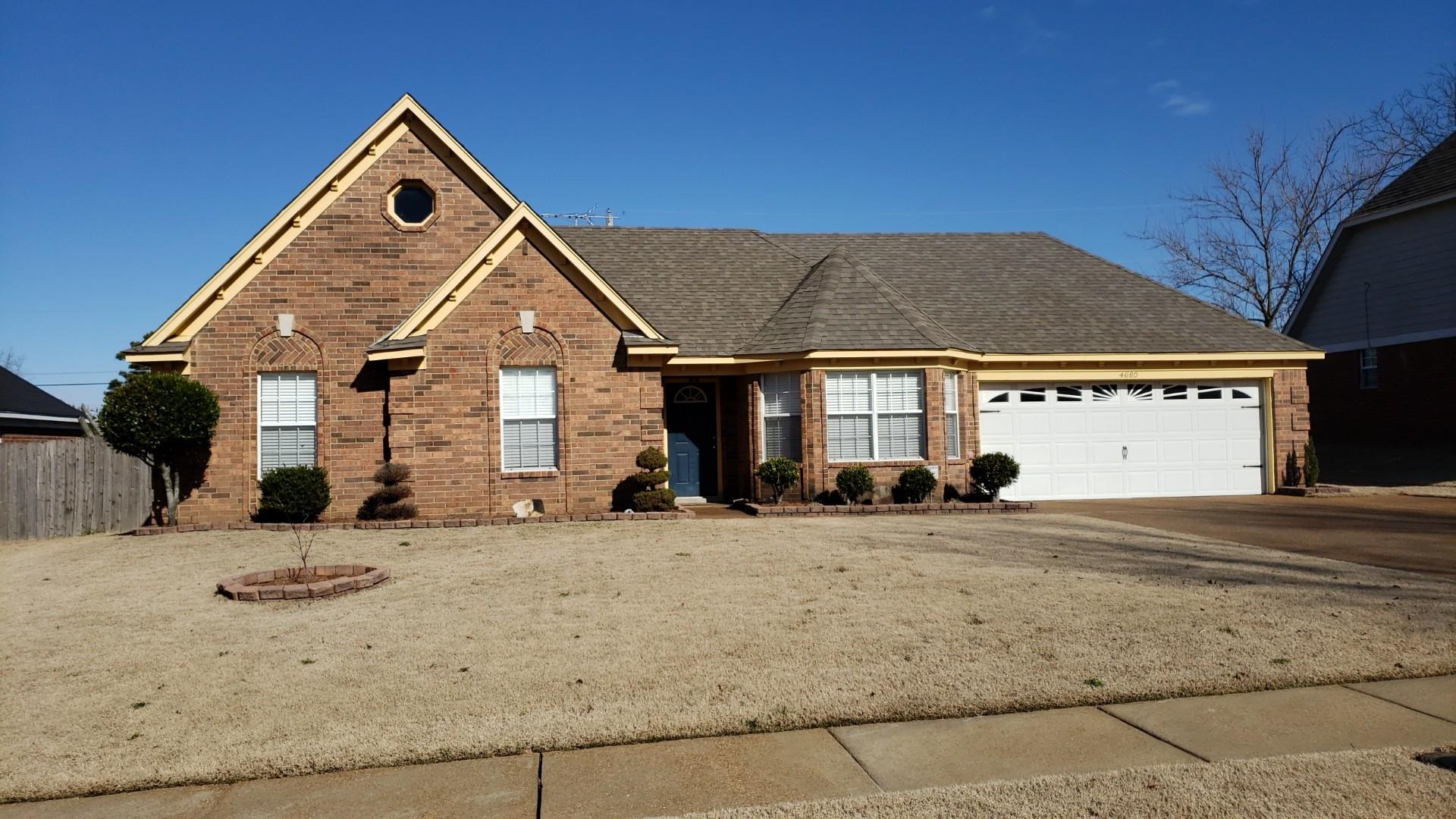 4680 Sun Ridge Drive Memphis, TN 38128 - Photo 1 of 16 Ranch-style house with an attached garage, brick siding, driveway, and a shingled roof