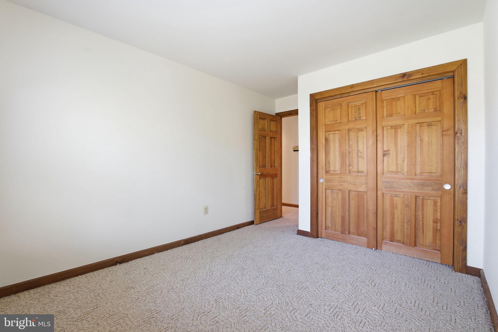 260 Grays Road Lothian, MD 20711 - Photo 33 of 48 Spacious room with warm wooden accents.