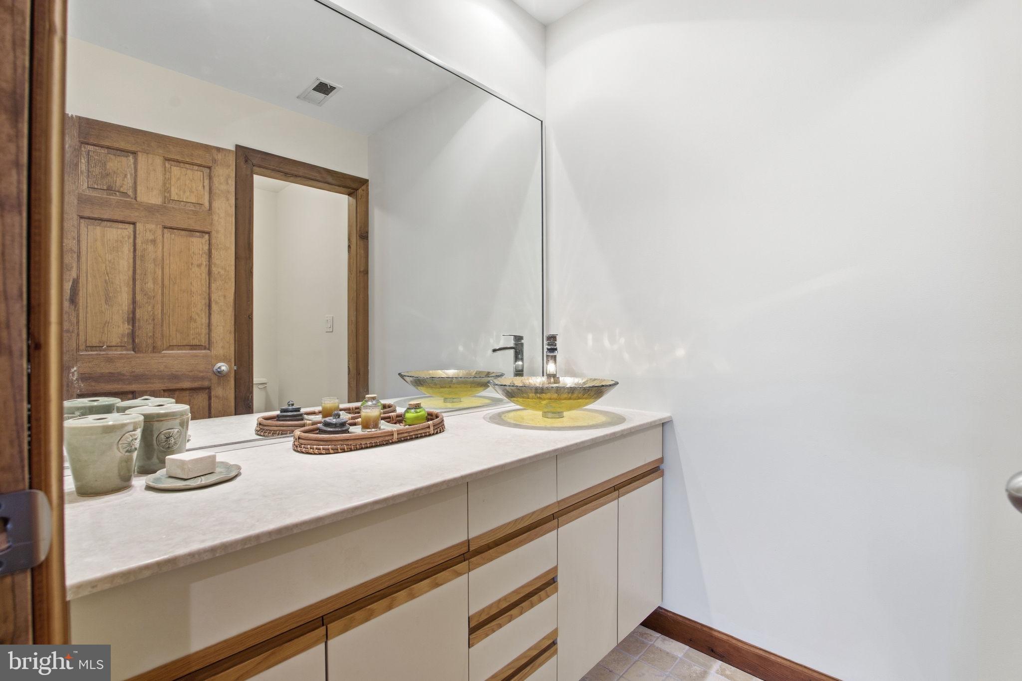 260 Grays Road Lothian, MD 20711 - Photo 34 of 48 Sleek modern bathroom with natural tones.