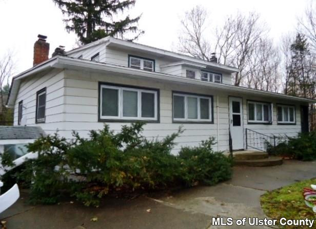 261 South Riverside Road Highland, NY 12528 - Photo 3 of 20 a front view of a house with a garden