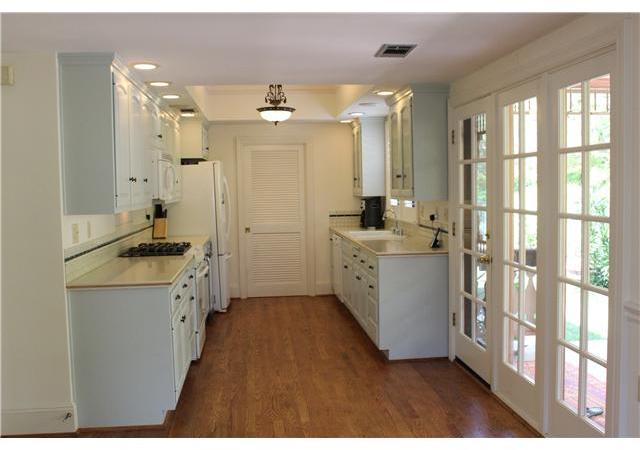 468 Rudd Road Vista, CA 92084 - Photo 13 of 21 Kitche with Laundry room and storage/pantry behind door, french doors open to back yard dining