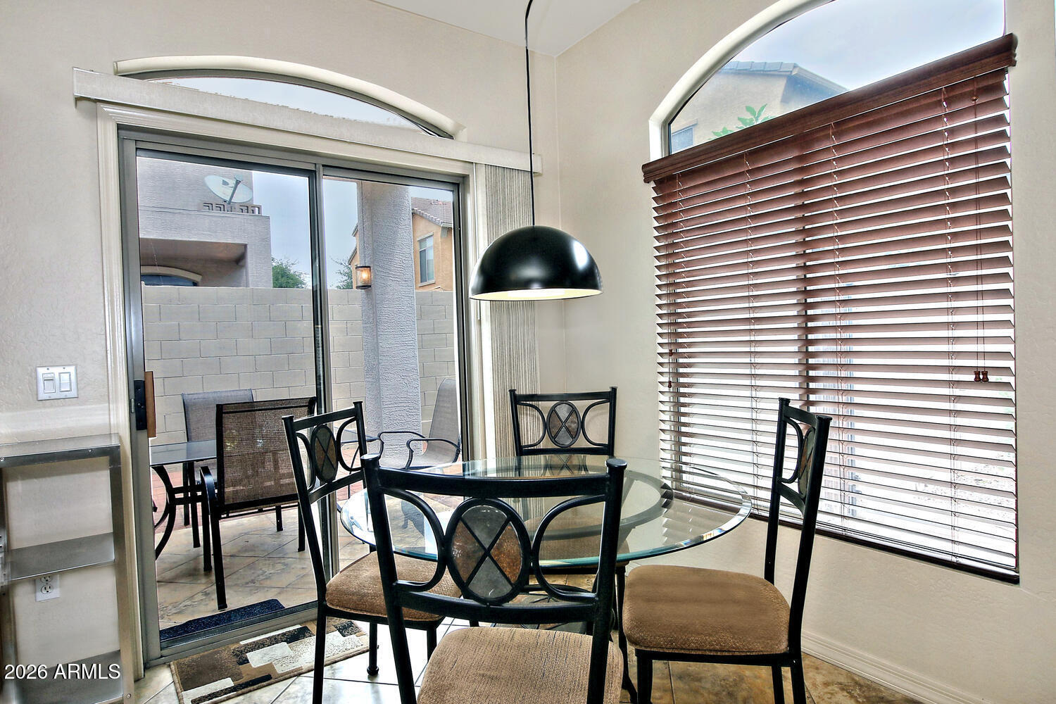 2150 East Bell Road, Unit 1069 Phoenix, AZ 85022 - Photo 12 of 33 a dining room with furniture and window