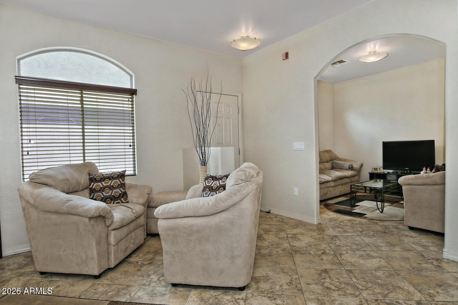 2150 East Bell Road, Unit 1069 Phoenix, AZ 85022 - Photo 14 of 33 a living room with furniture and a flat screen tv