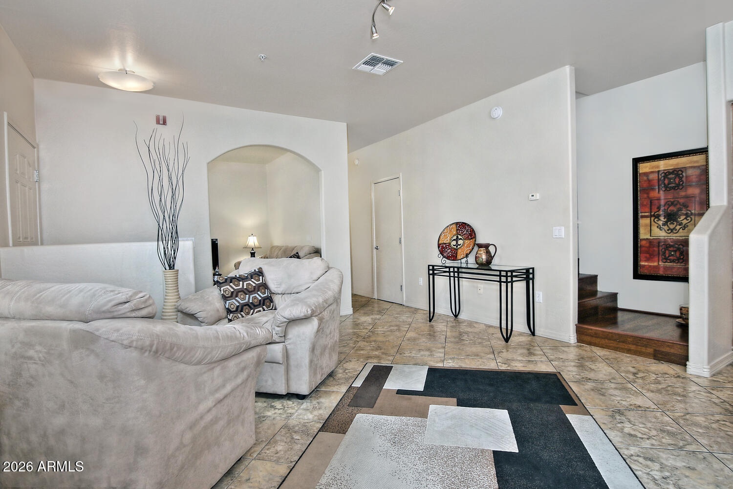 2150 East Bell Road, Unit 1069 Phoenix, AZ 85022 - Photo 16 of 33 a living room with furniture and a rug