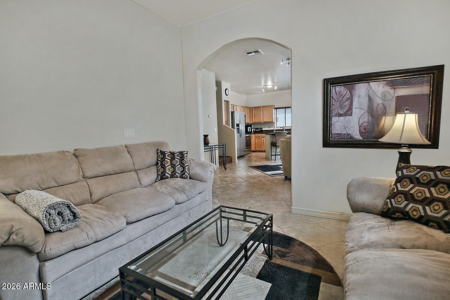 2150 East Bell Road, Unit 1069 Phoenix, AZ 85022 - Photo 17 of 33 a living room with furniture and painting on the wall