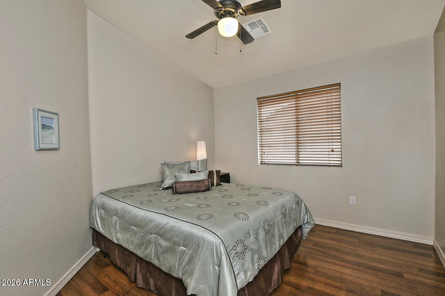 2150 East Bell Road, Unit 1069 Phoenix, AZ 85022 - Photo 29 of 33 a bedroom with a bed and a window