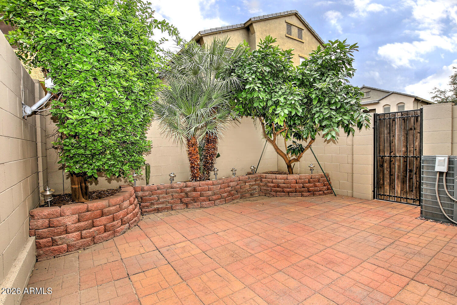 2150 East Bell Road, Unit 1069 Phoenix, AZ 85022 - Photo 3 of 33 a view of a house with a tree and a yard