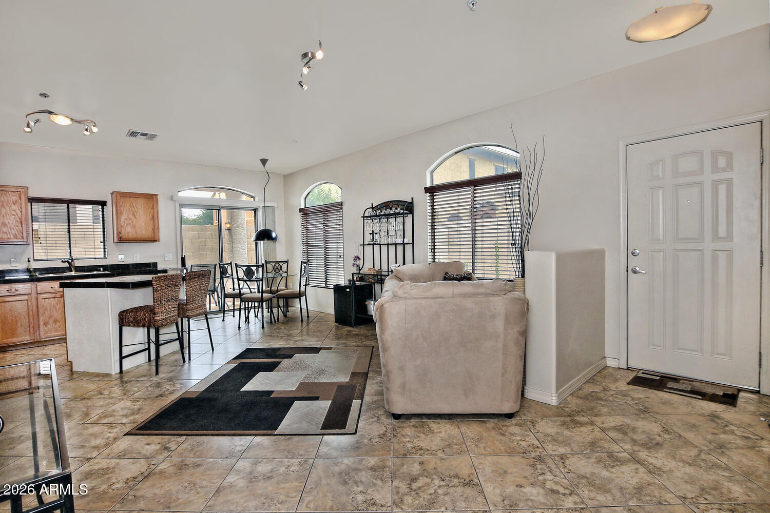 2150 East Bell Road, Unit 1069 Phoenix, AZ 85022 - Photo 8 of 33 a living room with furniture and a dining table