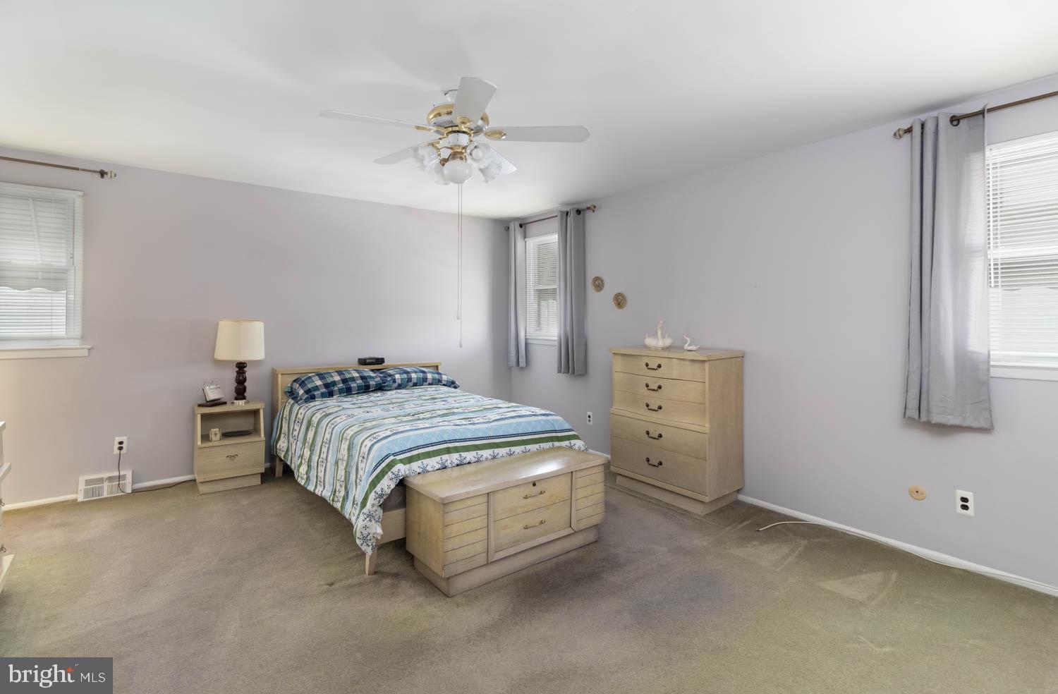 418 Densmore Road Philadelphia, PA 19116 - Photo 15 of 25 a spacious bedroom with a bed and window