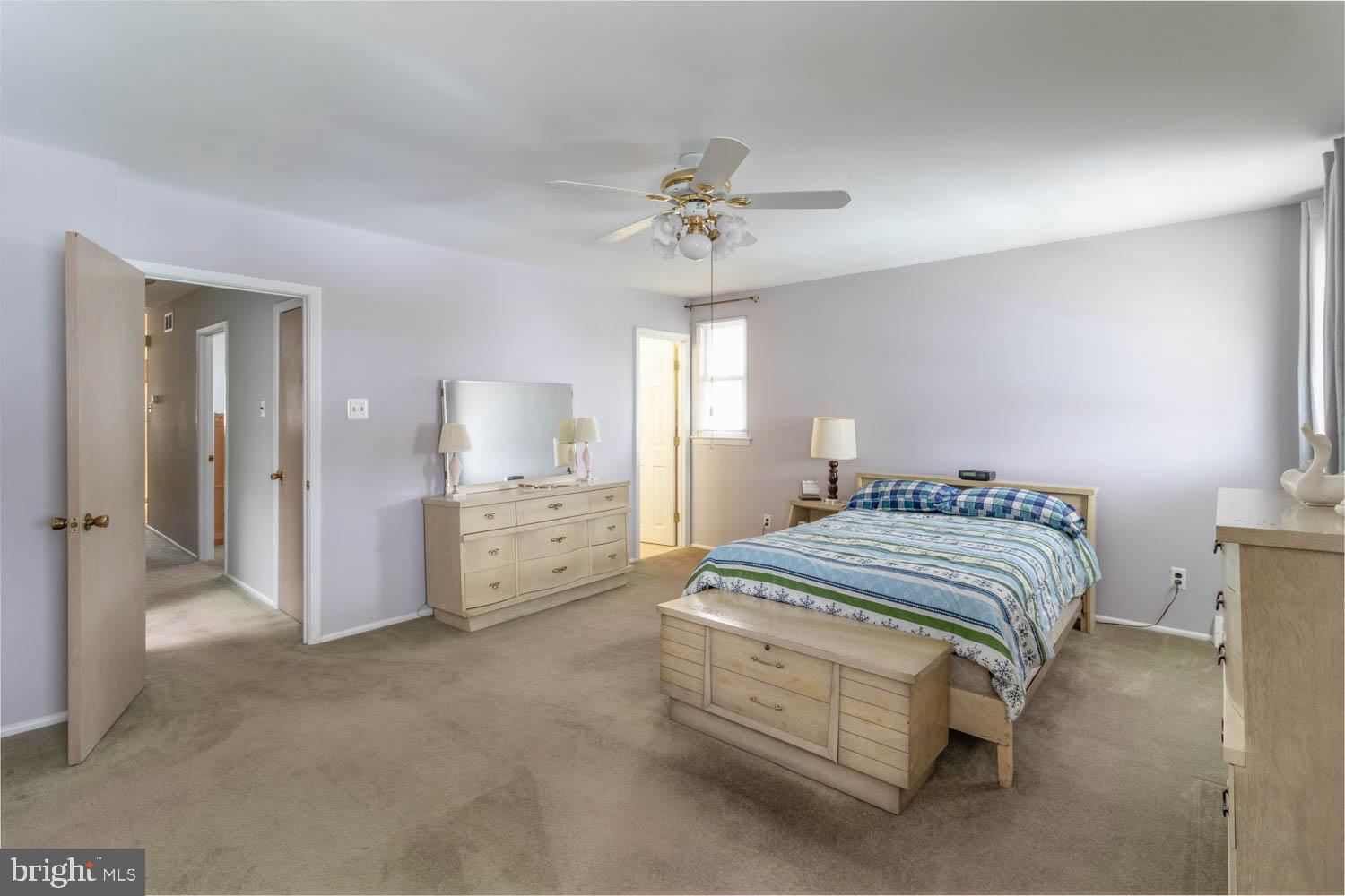 418 Densmore Road Philadelphia, PA 19116 - Photo 16 of 25 a bedroom with a bed and a chandelier