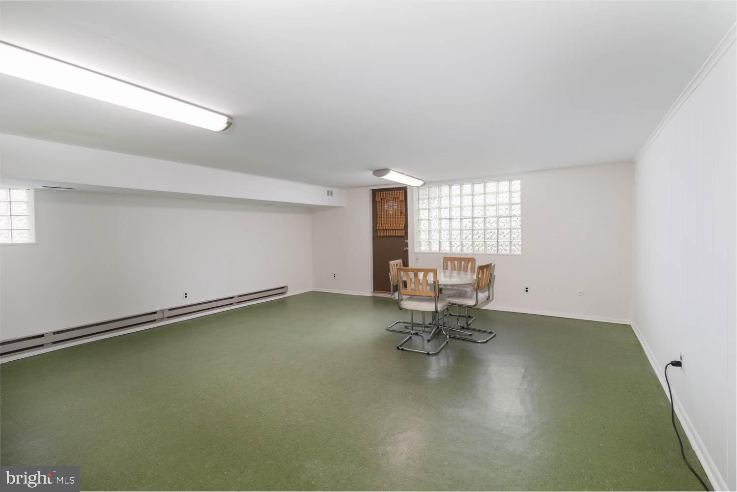 418 Densmore Road Philadelphia, PA 19116 - Photo 19 of 25 a view of a room with gym equipment and window