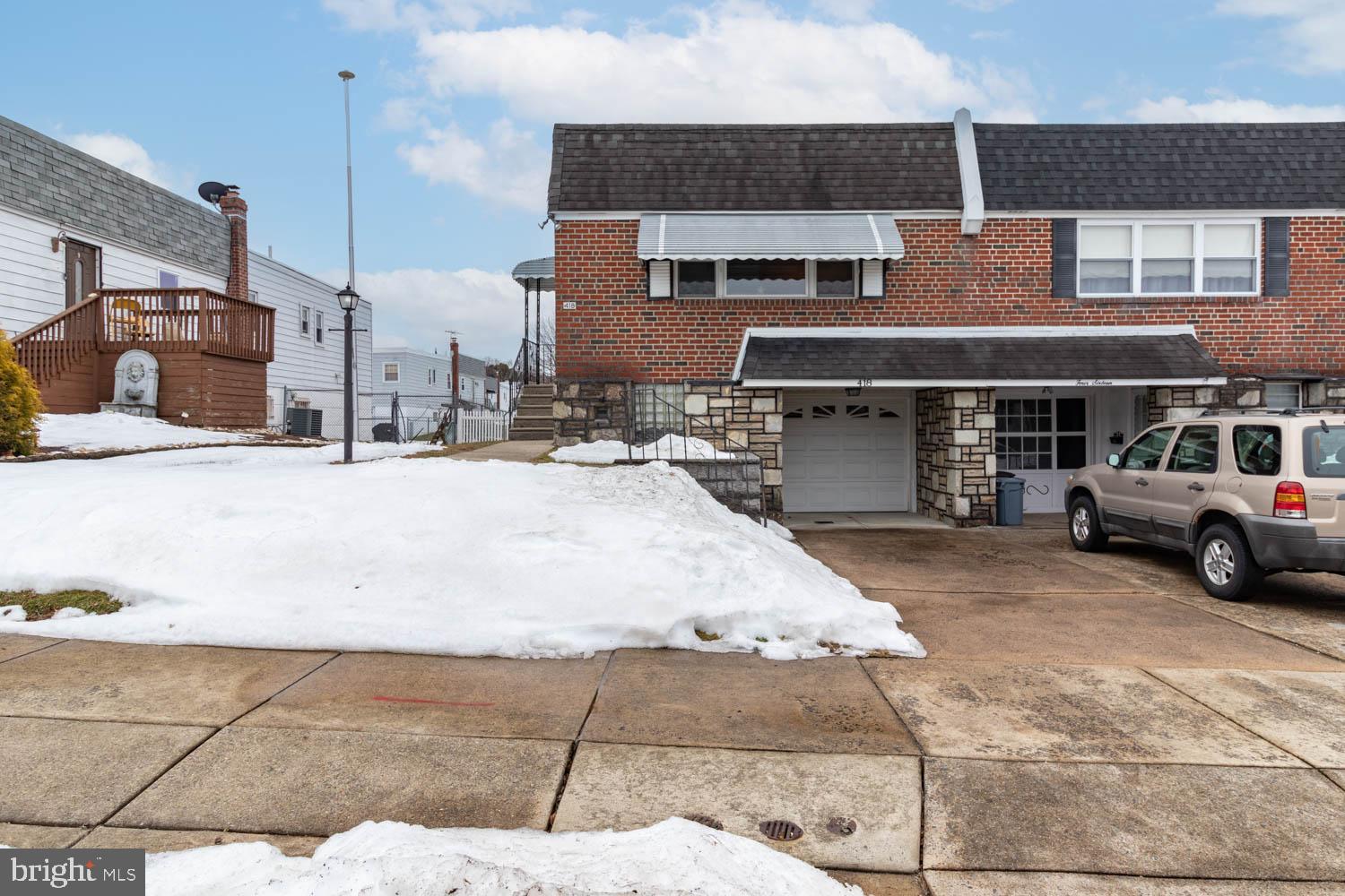 418 Densmore Road Philadelphia, PA 19116 - Photo 2 of 25 a car parked in front of house